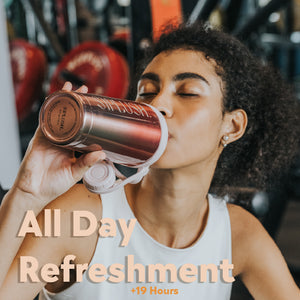 Woman drinking from SIPLUSH Pismo Sunset 24oz Stainless Steel Shaker Bottle at gym – All Day Refreshment over 19 hours cold lifestyle shot